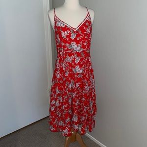 Floral v-neck summer dress with adjustable spaghetti straps and back zipper.